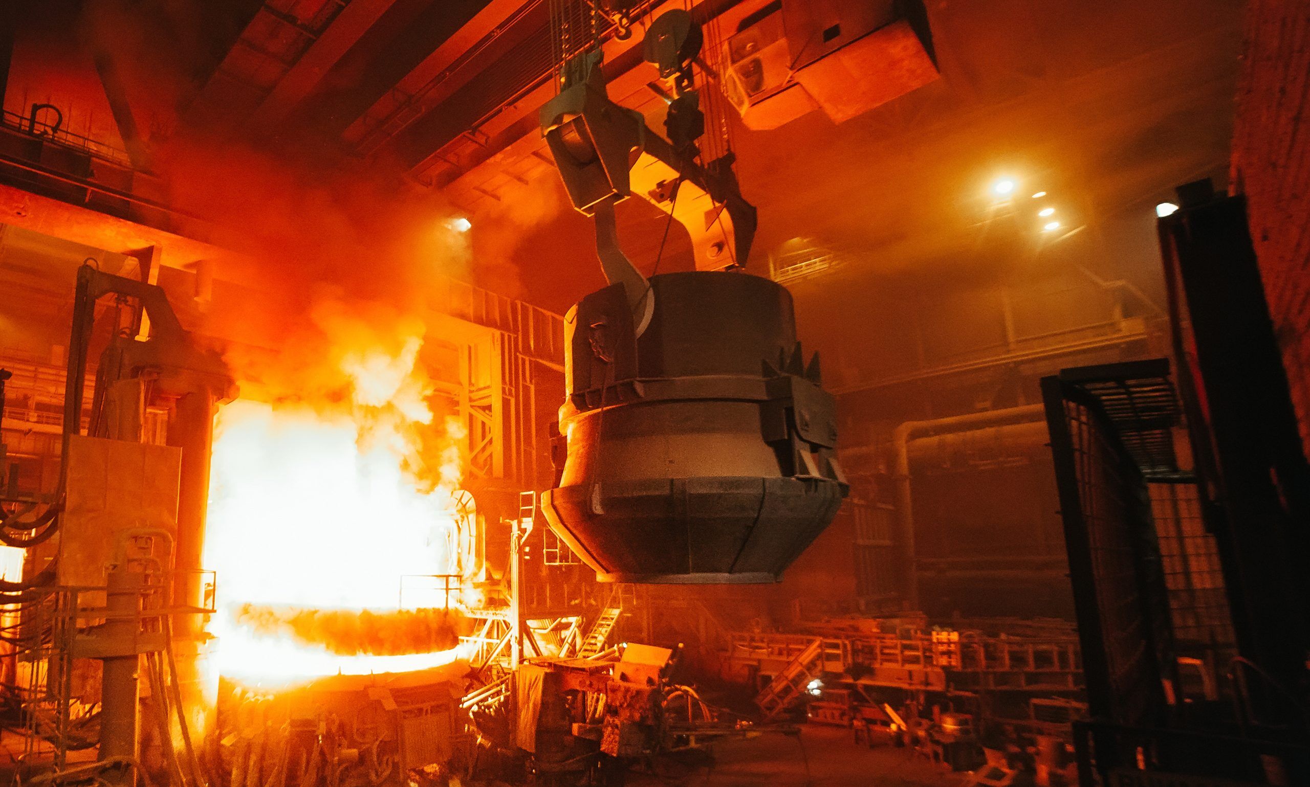 Molten Steel Vat entering industrial furnace for reheat