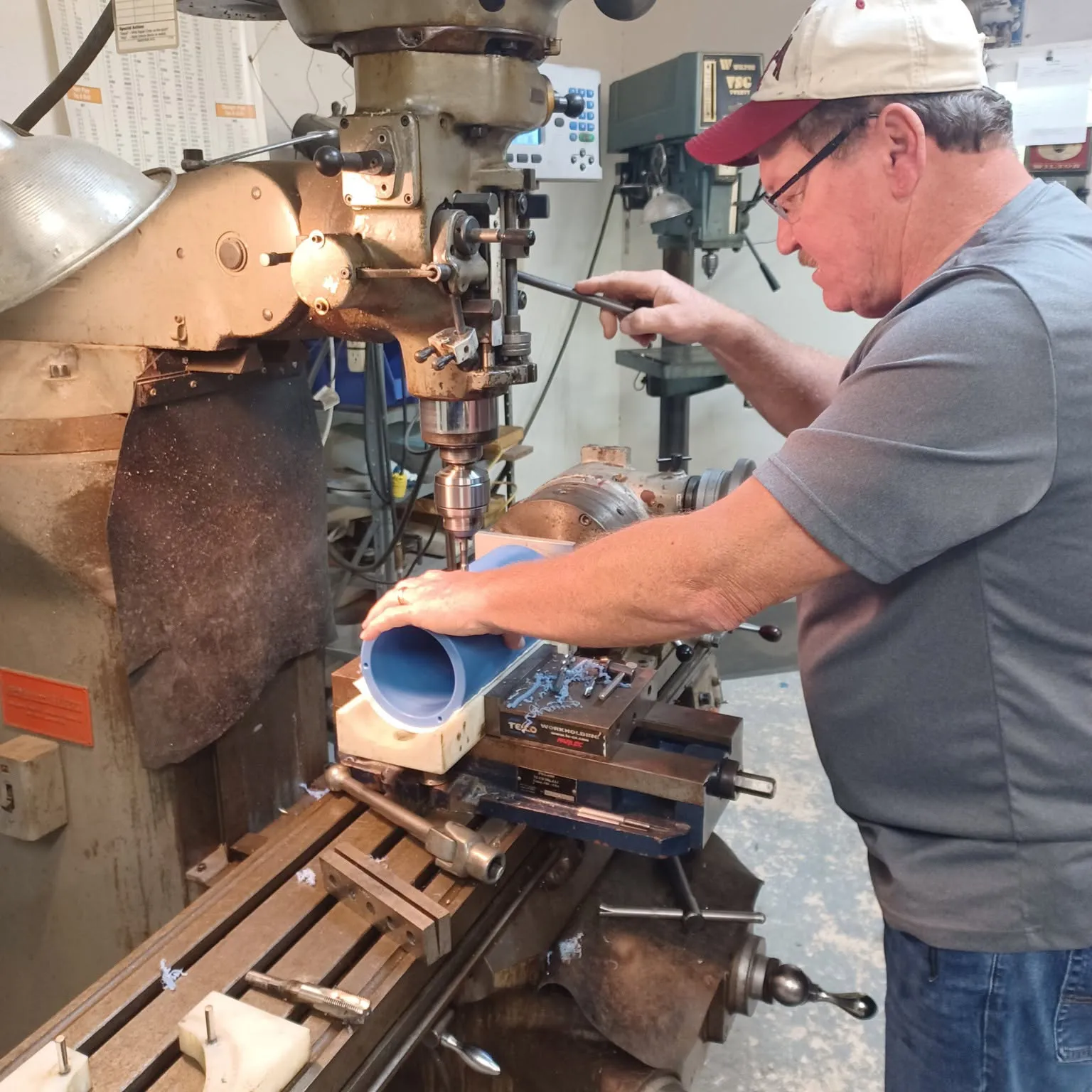 Syn-Fab machinist fabricating a high-temperature camera enclosure component in the Mobile, Alabama machine shop.