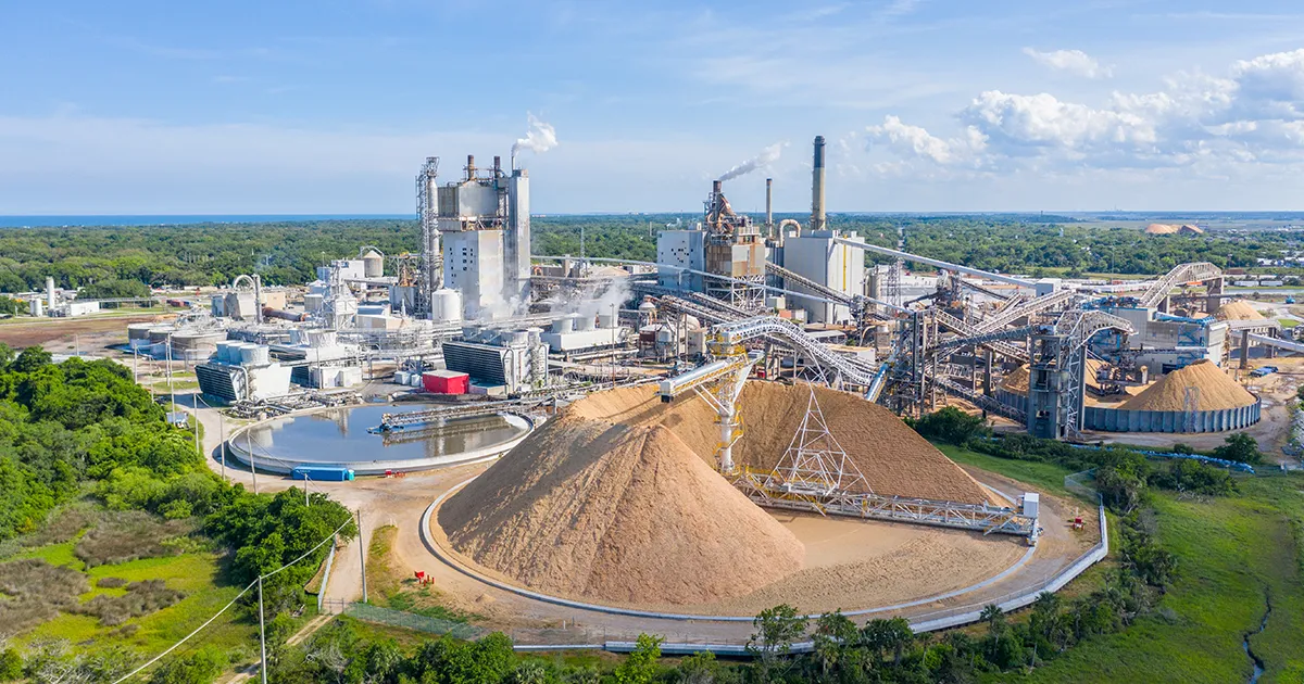 Aerial view of a paper mill wood yard and material handling conveyor system