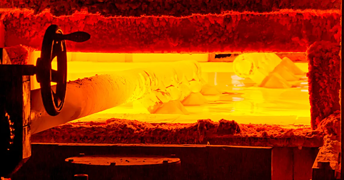 Interior view of an industrial glass melting furnace, a critical zone requiring high-temperature glass plant monitoring.